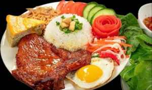 42. Grilled Pork Chop, Shreded Pork Skin, Sausage, Steam Egg and Deep Fried Egg w/ Broken Rice